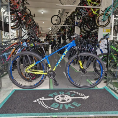 Bicicleta Alumínio Aro 29 Audax Havok SX Kit Shimano 21 Velocidades, Freio Hidraulíco, Garfo de Suspensão com Trava no Guidão, Quadro 17" ano 2023 - Azul Cyano com Amarelo